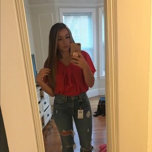 Small, red, free people bodysuit